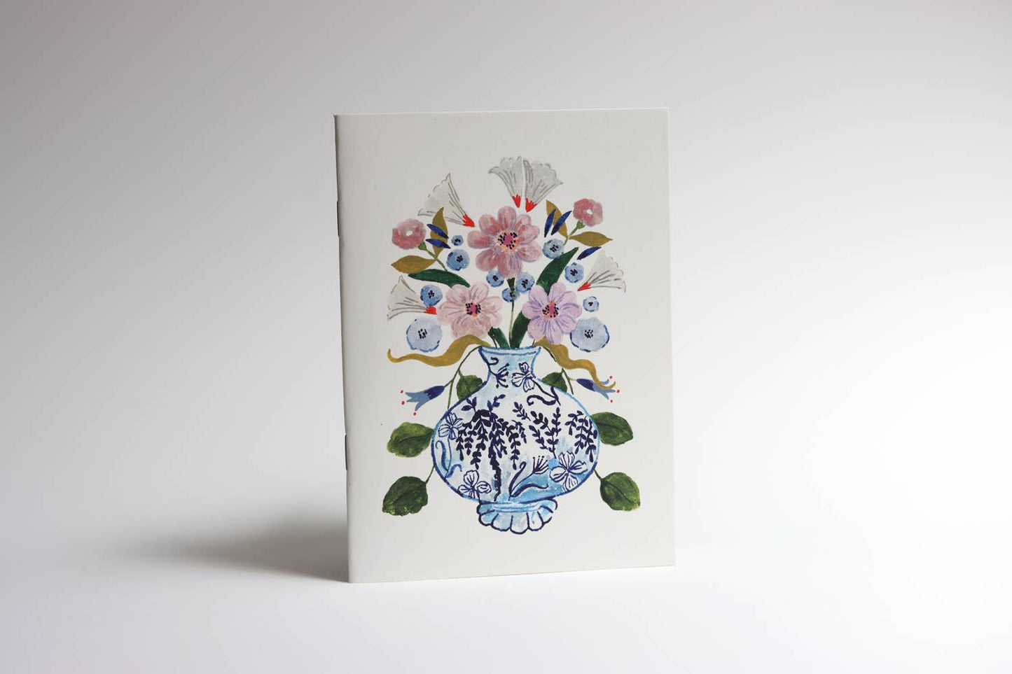 Flowers in blue vase pocket notebook