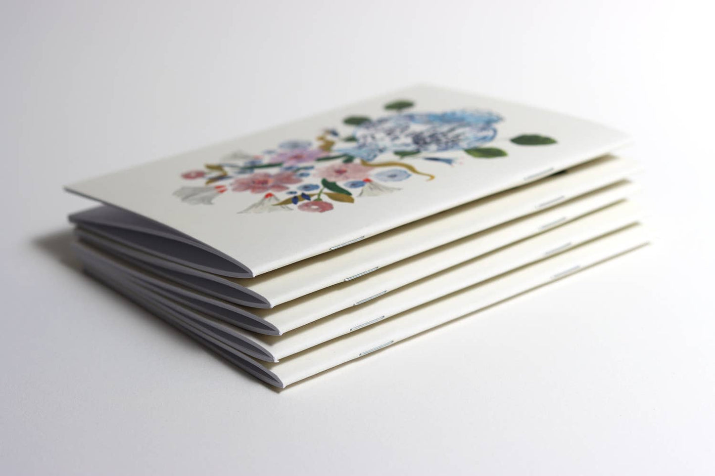 Flowers in blue vase pocket notebook